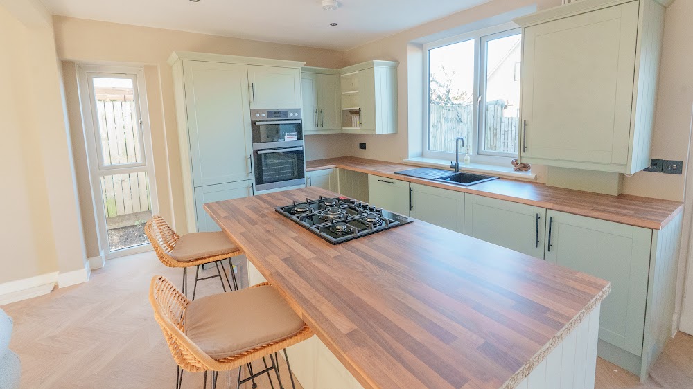 Shaker kitchen with a central island and gas hob