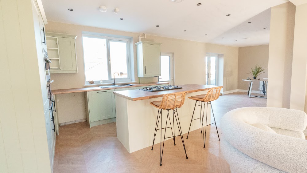 Open-plan kitchen flowing into a living space